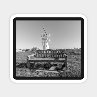 Wooden bench and traditional windmill on the riverbank Magnet