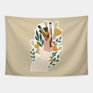 hand holding paint brushes surrounded by flowers sticker Tapestry