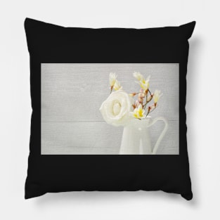 White flowers in jug. Roses in jug. Pillow