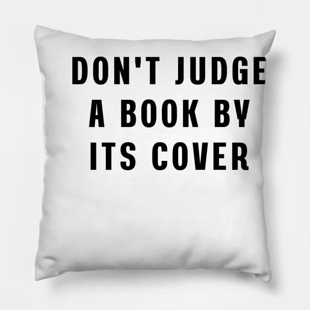 Don't judge a book by its cover Pillow by Puts Group