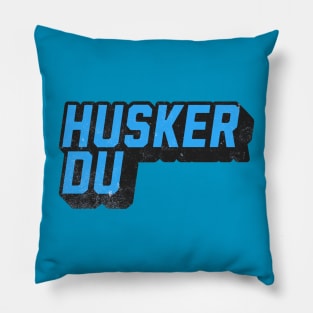 husker Under Blue Pillow