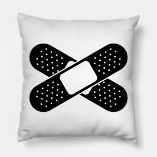 Two Bandaids Crossed Over Pillow