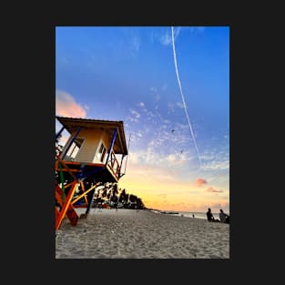 A sun-drenched beach with a crystal-clear ocean stretching out to the horizon. T-Shirt