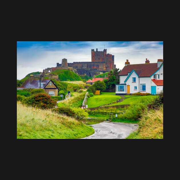 View of Bamburgh village and castle, Northumberland, UK by Itsgrimupnorth