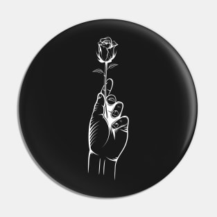 Hand Holding a Rose Pin