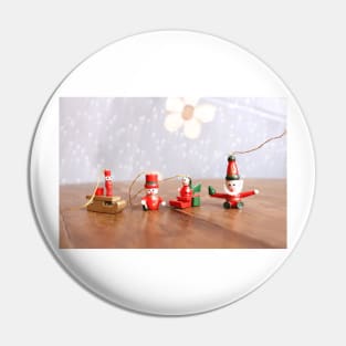 Four Christmas figurines Pin