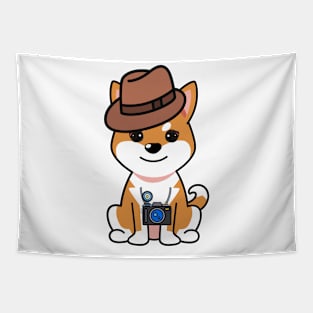 Cute orange dog is holding a camera Tapestry