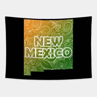 Colorful mandala art map of New Mexico with text in green and orange Tapestry