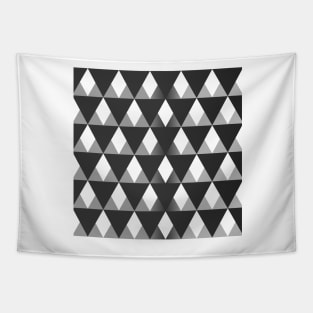 Black and grey triangular pattern background filling the frame. Tapestry