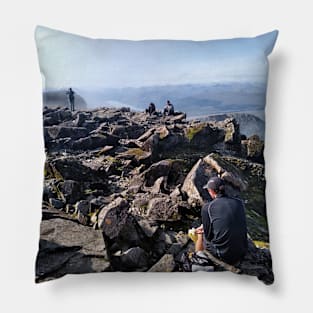 Climbers rest at the summit of Ben Nevis Pillow