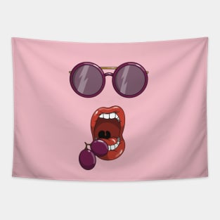 Mouth about to eat a two purple grapes while wearing matching purple sun glasses. Tapestry