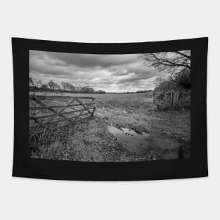 Wooden gate entrance to an arable field in the English countryside Tapestry