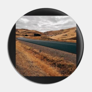 Road Through Barren Countryside Pin