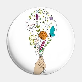 Hand holding beautiful flowers Pin