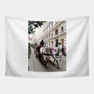 White horses adorned in formal regalia pulling carriages in city street. Tapestry