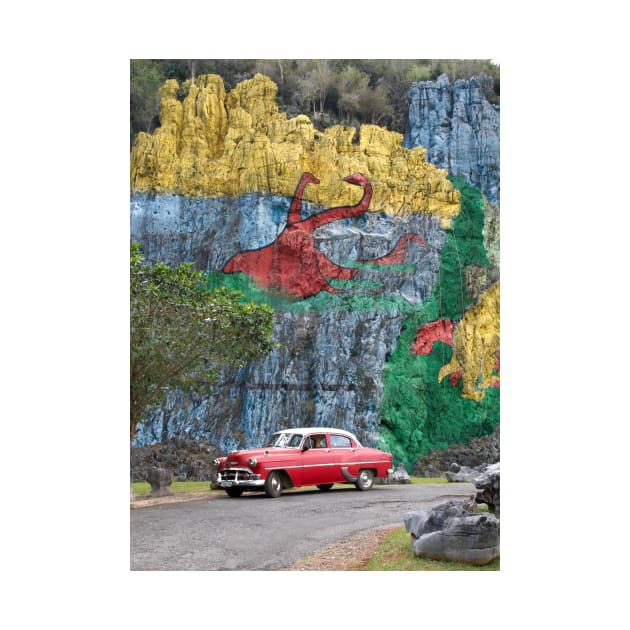 Vintage cars in front of the Mural de la Prehistoria in Cuba by Offiinhoki