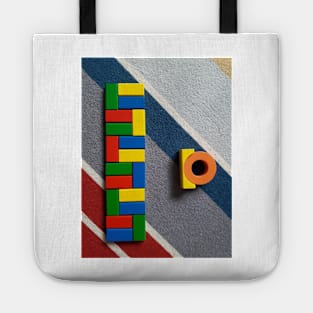 Colorful building blocks on carpet 1 Tote