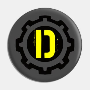 A Yellow Letter D in a Black Industrial Cog Pin