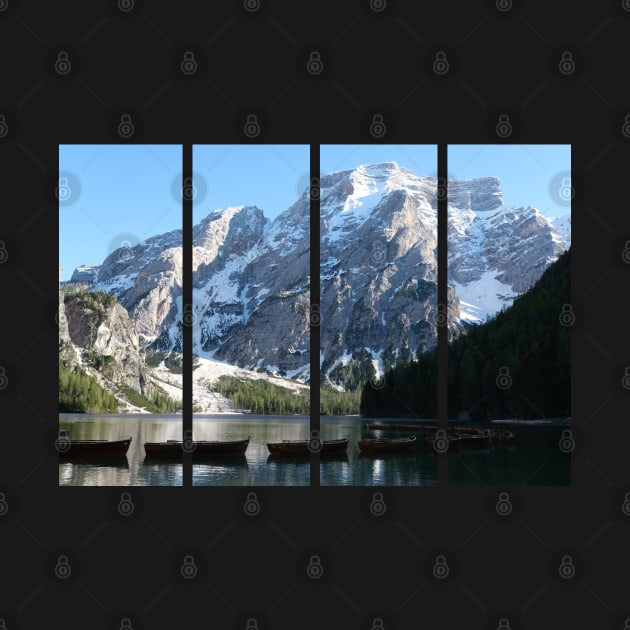 The fabulous alpine lake of Braies in the Dolomites (Bolzano). Lovely place in the Italian Alps. Boats on the water. Reflections in the water. Sunny spring day. Trentino Alto Adige by fabbroni-art