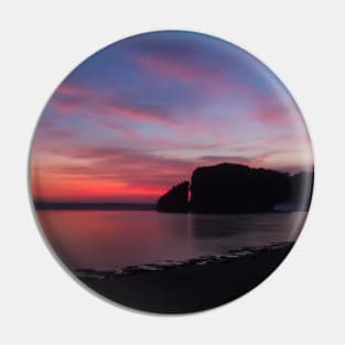 Silhouetted rock stack at a red sunset beach Pin