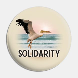 Solidarity Pelican Flying Over the Sea Pin