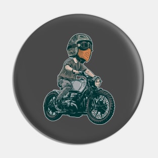 Urban Rider: Man Rocking a Cool Helmet on a Bobber Motorcycle Pin