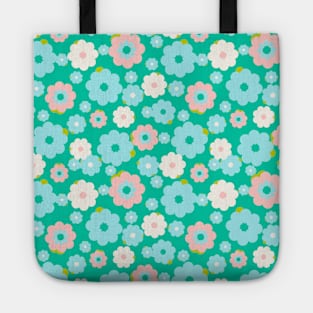 Small blue, white and pink flowers over a turquoise background Tote