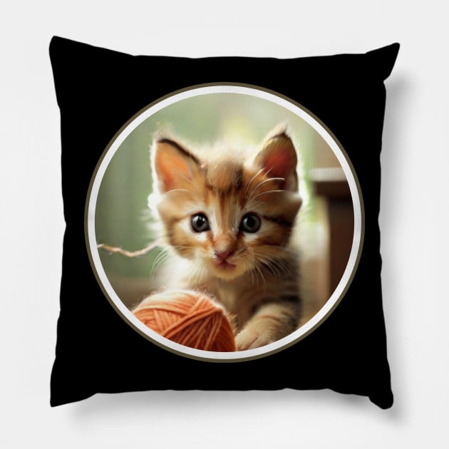 A playful kitten chasing a ball of yarn. Pillow by benzshope