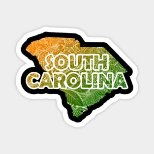 Colorful mandala art map of South Carolina with text in green and orange Magnet
