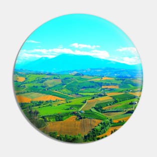 Scene in Carassai with fields sectoring the lands and impressive mountains Pin