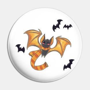 Cozy bat with a scarf and spooky friends on Halloween Pin