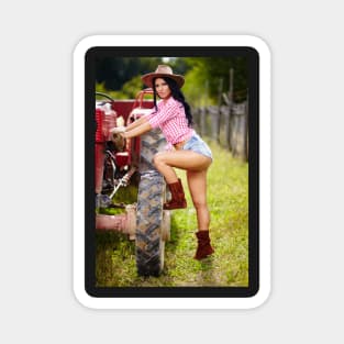 Sexy farmer girl in hat near the tractor Magnet