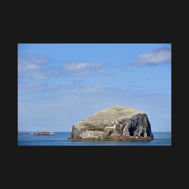 A cargo ship passes Bass Rock, Scotland by richflintphoto