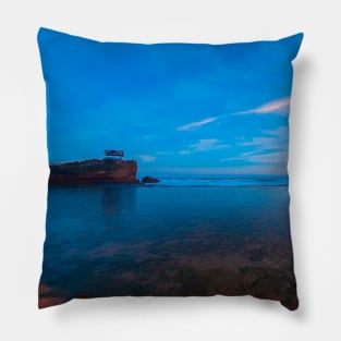 A rock stack creeping out of the blue ocean Pillow