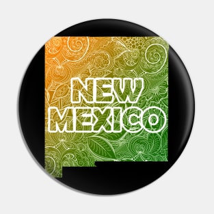 Colorful mandala art map of New Mexico with text in green and orange Pin