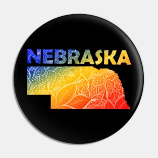 Colorful mandala art map of Nebraska with text in blue, yellow, and red Pin