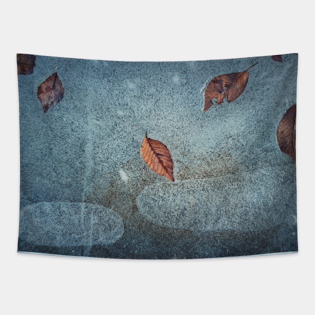 fallen leaves frozen in a puddle Tapestry by psychoshadow