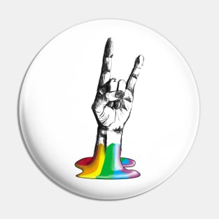 Hand making metal rock gesture coming out of rainbow Pin