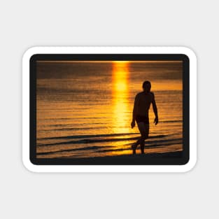 Silhouette of man in the golden light at St KIlda Beach, Melbourne. Magnet