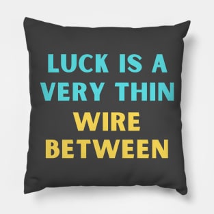 Luck is a very thin wire between Pillow