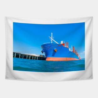 Large blue and red ship in port. Tapestry