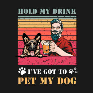 Hold my drink, I've got to pet my dog sunset distressed beer German shepherd design. T-Shirt