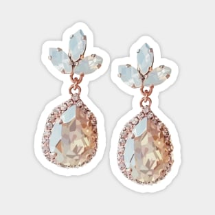 Rose-gold costume jewellery earrings with nude crystals and moon stones. Magnet