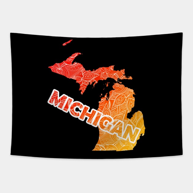 Colorful mandala art map of Michigan with text in red and orange 