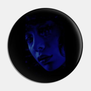 Beautiful girl face in dark blue lighting. Beautiful light tones defines shapes. Pin