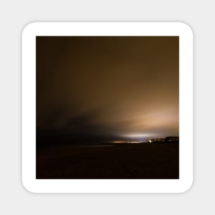 Beach of Carnon with an Illuminated Cloud Cover at Night Magnet