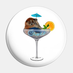 Slow loris. Cheers! Fat and funny is sitting in a cocktail glass with cocktail umbrella Pin