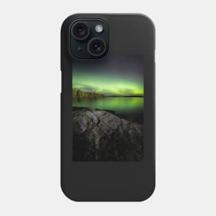 Northern lights glowing over lake in Finland Phone Case