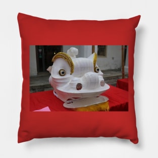 Unfinished white plastered Chinese Dragon mask on a festival Pillow