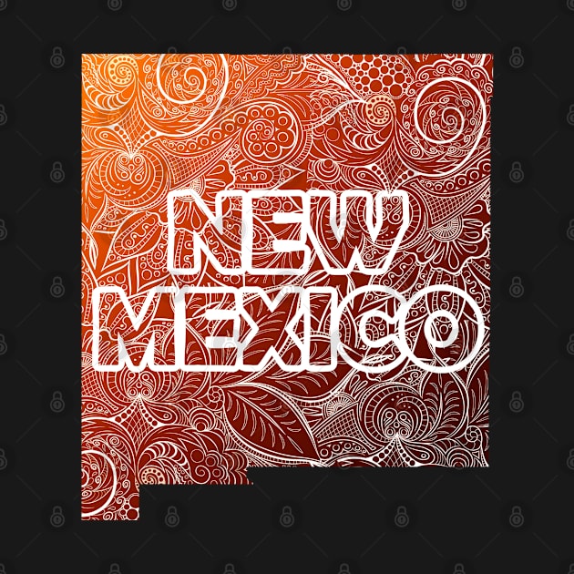 Colorful mandala art map of New Mexico with text in brown and orange by Happy Citizen